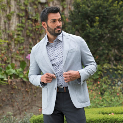 Man in a gray sport coat demonstrating how to achieve a professional look